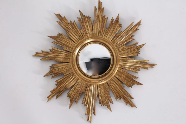 Witch's eye sun mirror made of gilded wood