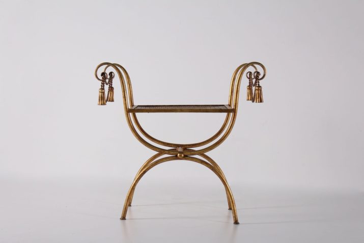 Curule armchair in gilded metal