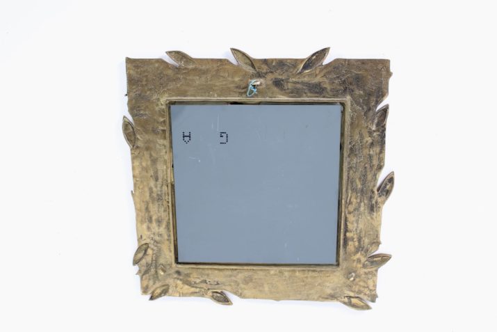 Square mirror with plant decoration