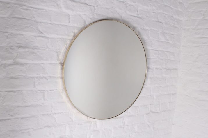 Large round mirror with golden contour