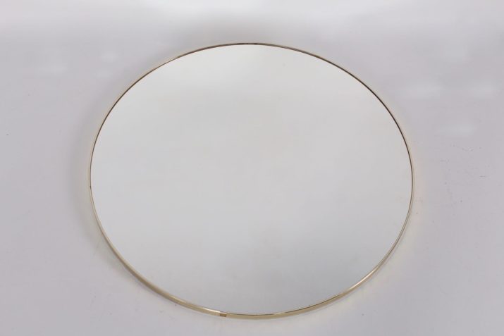 Large round mirror with golden contour