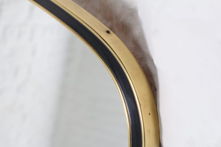 Important free form mirror in brass