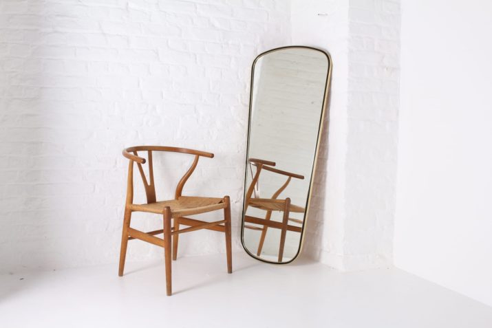 Important free form mirror in brass