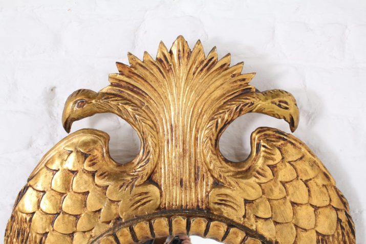 Convex mirror in gilded wood, double-headed eagle