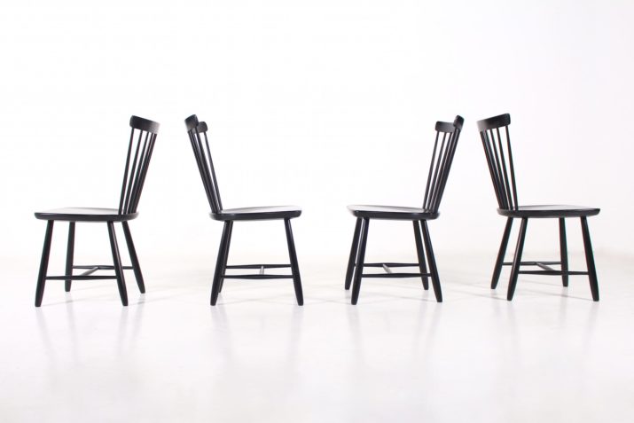 4 black chairs with bars