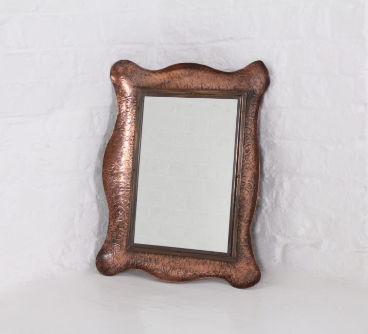 Hammered copper mirror.