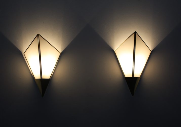 Pair of postmodernist sconces in brass