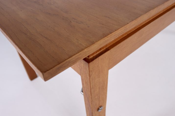 Modernist table with central extension