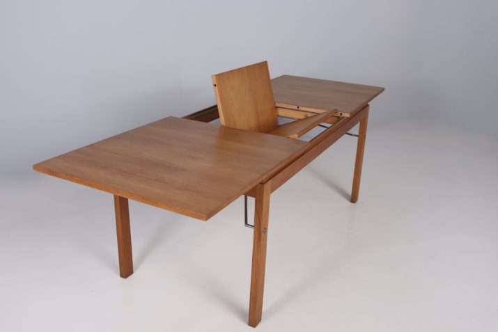 Modernist table with central extension