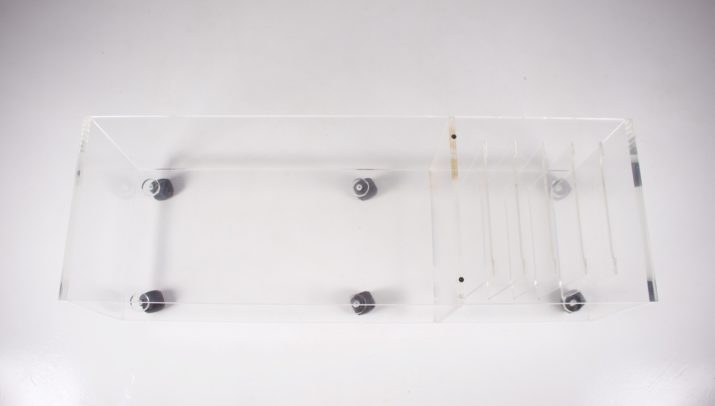 Low transparent plexiglass sideboard.