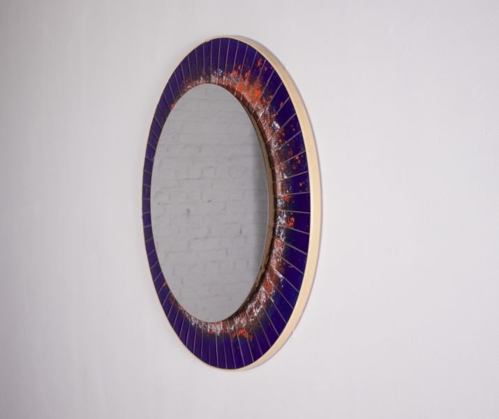 Mirror with enamelled copper decoration