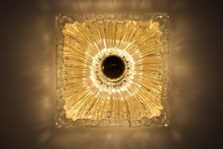 Flower wall lights in pressed glass.