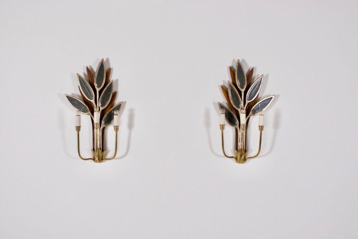 Pair of sconces with mirrored leaves