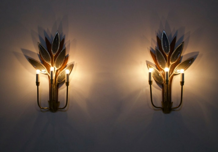 Pair of sconces with mirrored leaves