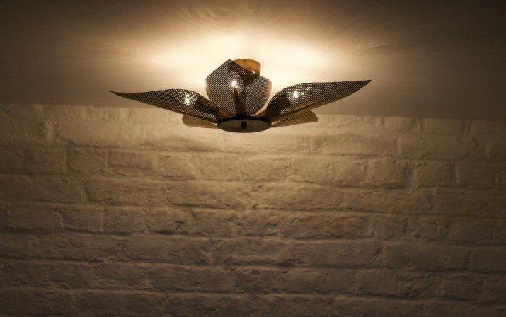 Ceiling light with perforated brass petals.