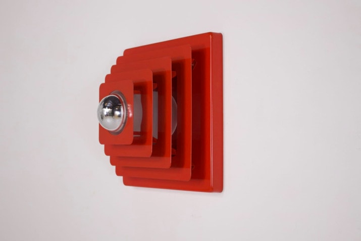 Red kinetic wall lamp.