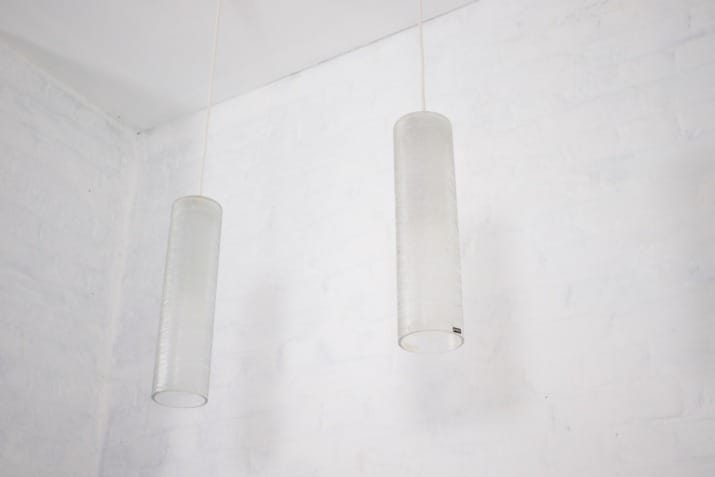 Doria suspension fixtures in frosted glass.