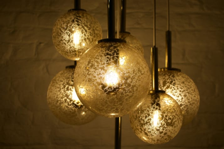 Cascade" brass chandelier with amber globes